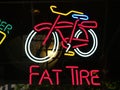 Bright colours neon sign promoting Fat Tire beer in window at night