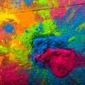 Bright colours on sawed wood for Indian holi festival. Colorful gulal powder colors for Happy Holi with copy space Royalty Free Stock Photo