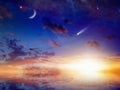 Bright comet, stars and crescent in sunset sky with reflection i Royalty Free Stock Photo