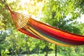 Bright comfortable hammock hanging in garden