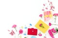 Bright composition with notebook, clips, gift and roses flowers on white. Flat lay Royalty Free Stock Photo