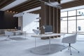 Bright concrete and wooden office interior with equipment, daylight and partitions.