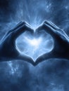 Bright Cosmic Heart Formed by Hands in a Glowing Nebula, Showcasing Connection and Love in a Galaxy Setting Royalty Free Stock Photo