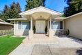 Bright covered porch with columns and tile floor Royalty Free Stock Photo