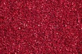 Bright crimson background with glitter. Red glitter texture. Royalty Free Stock Photo