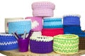 Bright crochet colorful boxes and crochet hooks on the wooden tabl isolated on white. Thick ribbon cotton yarn. Royalty Free Stock Photo