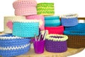 Bright crochet colorful boxes and crochet hooks on the wooden tabl isolated on white. Thick ribbon cotton yarn. Royalty Free Stock Photo