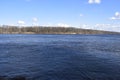 Bright, dark blue river and sky, visible second Bank Royalty Free Stock Photo