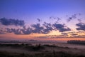 Bright dawn on a misty meadow. Bright summer landscape Royalty Free Stock Photo