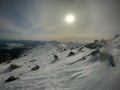 Bright dazzling winter sun over the mountains