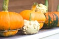 Bright decorative pumpkins on the windowsill of a country house