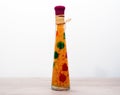 Bright decorative sealed glass bottle with carrot