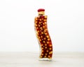 Bright decorative sealed glass bottle with farci pepper Royalty Free Stock Photo