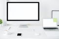 Bright designer desktop with computer and laptop Royalty Free Stock Photo