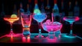 Bright different cocktail glasses. Colored pink blue yellow night club party alcoholic drinks. Cheers holiday restaurant