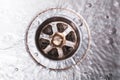 Bright Dirty Drain Of A Kitchen Sink With Flowing Water, Top Down View Royalty Free Stock Photo