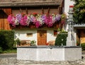 Bright display of windowboxes in Swiss village Royalty Free Stock Photo