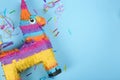 Bright donkey pinata and confetti on background, flat lay. Space for text Royalty Free Stock Photo