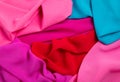 Bright draped background of multi-colored fabric