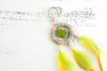 Bright dream catcher with green cross Royalty Free Stock Photo