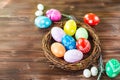 Bright early colored easter eggs wooden background Royalty Free Stock Photo