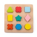 bright educational puzzle toy made of natural wood for children on a white isolated background Royalty Free Stock Photo