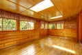 Bright empty log cabin house interior with skylights Royalty Free Stock Photo