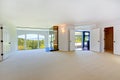 Bright empty room with fireplace and arch window