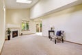 Bright empty room with high vaulted ceiling and skylight