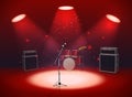 Bright empty scene with microphone, drum set and amplifiers in the light of spotlights