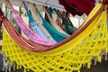 Bright ethnic hammocks with various pattern hanging in street market