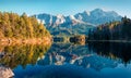 Bright evening scene of Eibsee lake with Zugspitze mountain range on background. Beautifel autumn view of Bavarian Alps, Germany,