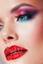 Bright eye makeup and red lips in rhinestones. Pink and blue color, colored eyeshadow. Royalty Free Stock Photo