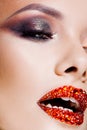 Bright eye makeup and red lips in rhinestones. Smokey eyes, colored eyeshadow. Royalty Free Stock Photo