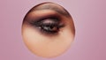 Bright eye makeup. Smokey eyes, colored eyeshadow. round cutout in paper. Royalty Free Stock Photo