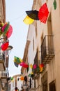 Bright fans above narrow European street Royalty Free Stock Photo