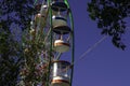 A bright Ferris wheel against the blue sky in the park Royalty Free Stock Photo