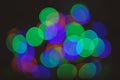 Bright and festive atmosphere of coming holiday. Christmas decorations concept. Defocused light of colorful garland Royalty Free Stock Photo