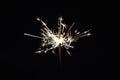 Bright festive Christmas sparkler in hand toning Royalty Free Stock Photo