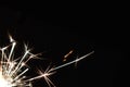 Bright festive Christmas sparkler in hand toning Royalty Free Stock Photo