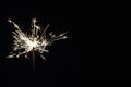 Bright festive Christmas sparkler in hand toning Royalty Free Stock Photo