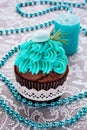 Bright, festive cupcake, candle and macaroon Royalty Free Stock Photo