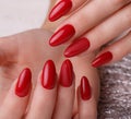 Bright festive red manicure on female hands. Nails design Royalty Free Stock Photo