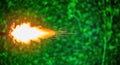 Bright Fireball Explosion with Sparks in Green Forest Environment Royalty Free Stock Photo