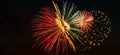 Bright fireworks on a festive night. Colored lights in the dark sky for a holiday. Banner format Royalty Free Stock Photo