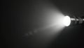 Bright flashlight beam cuts through dark space. Metal torch creates strong light ray. Illumination reveals path ahead. Powerful Royalty Free Stock Photo