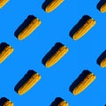 flat seamless pattern of peeled corn on a blue background