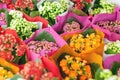 Bright floral background of colorful bouquets in flower market