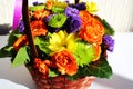 Bright flower arrangement (ikebana) in a basket Royalty Free Stock Photo