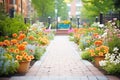 bright flowerbeds flanking a brick walkway